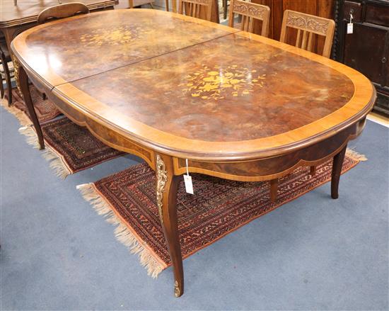 A Louis XVI style walnut and marquetry extending dining table 300cm extended